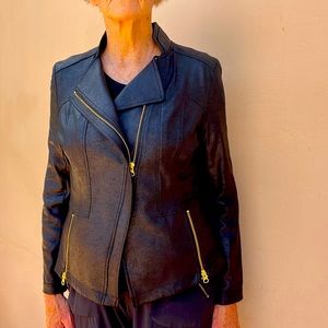 Faux leather light weight. 95% poly, 5% spandex. Hand wash